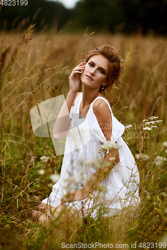 Image of beautiful girl in field