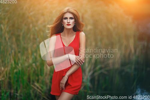 Image of beautiful girl in field