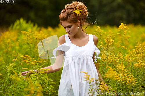 Image of beautiful girl in field