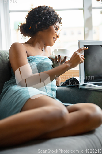 Image of Beauty Day. Woman doing her daily skincare routine at home