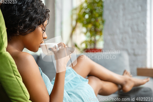 Image of Beauty Day. Woman doing her daily skincare routine at home