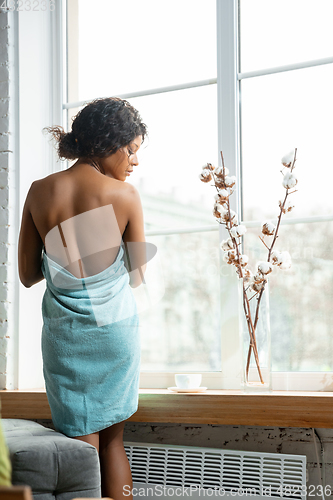 Image of Beauty Day. Woman doing her daily skincare routine at home