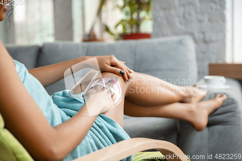Image of Beauty Day. Woman doing her daily skincare routine at home