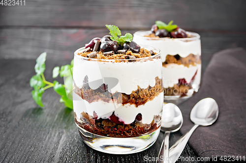 Image of Dessert Black Forest in two glasses on wooden table