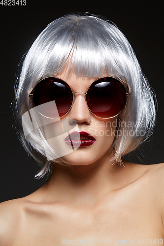 Image of girl in silver wig and round sunglasses