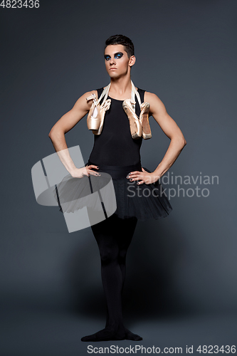 Image of handsome ballet artist in tutu skirt