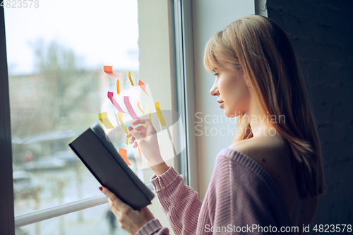 Image of Beautiful caucasian business lady working in office, open-space