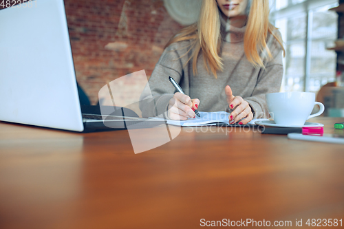 Image of Beautiful caucasian business lady working in office with laptop