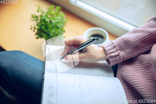 Image of Beautiful caucasian business lady working in office, open-space