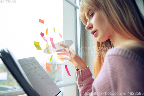 Image of Beautiful caucasian business lady working in office, open-space