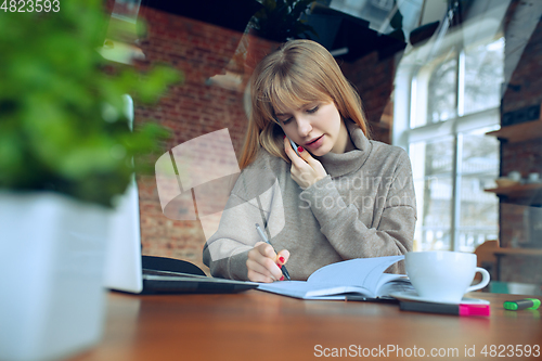 Image of Beautiful caucasian business lady working in office with laptop