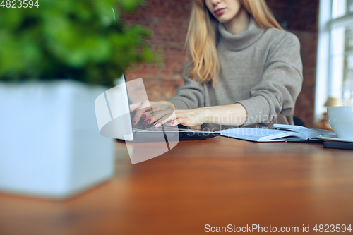 Image of Beautiful caucasian business lady working in office with laptop