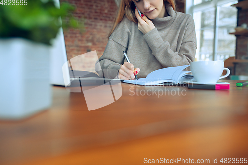 Image of Beautiful caucasian business lady working in office with laptop