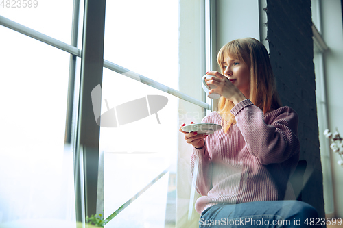 Image of Beautiful caucasian business lady working in office, open-space