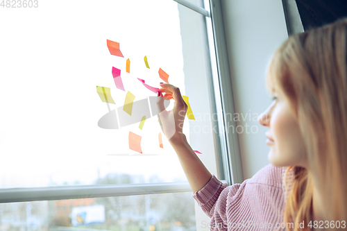 Image of Beautiful caucasian business lady working in office, open-space