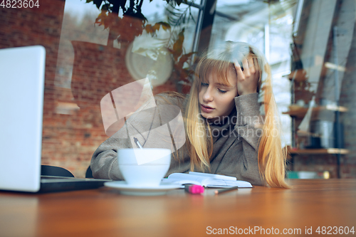 Image of Beautiful caucasian business lady working in office with laptop