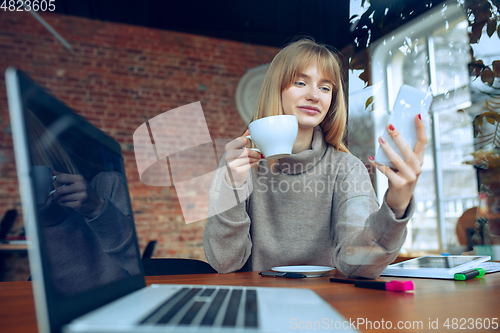 Image of Beautiful caucasian business lady working in office with laptop