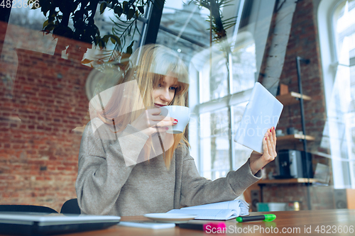 Image of Beautiful caucasian business lady working in office with laptop