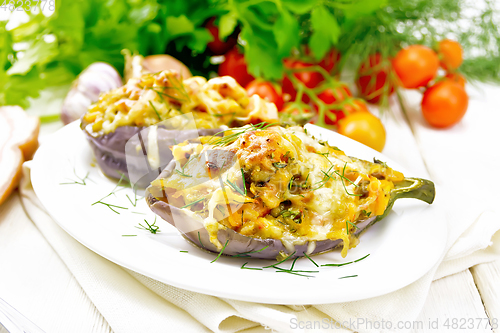 Image of Eggplant stuffed smoked brisket in plate on wooden board