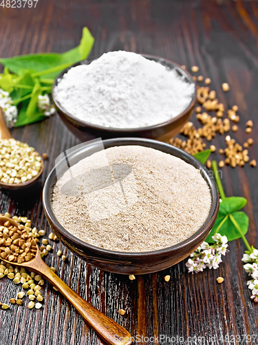 Image of Flour buckwheat brown and green in bowls on wooden board