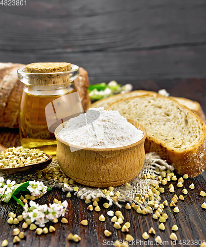 Image of Flour buckwheat green in bowl with bread on table