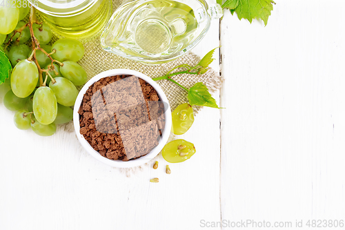 Image of Flour grape seed in bowl on board top