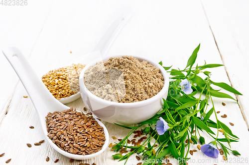 Image of Flour linen in bowl with seeds on light wooden board