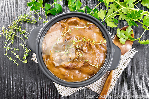 Image of Goulash of beef in pan on dark board top