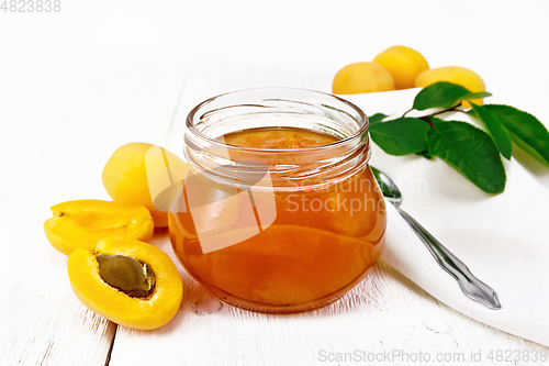 Image of Jam apricot in jar on white board