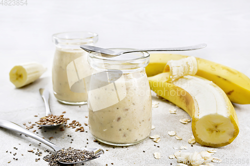 Image of Milkshake with chia and banana in jars on table