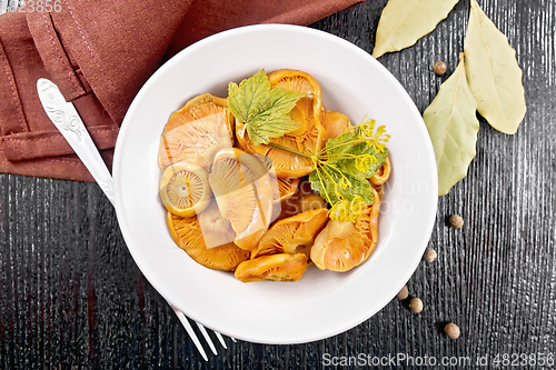 Image of Mushrooms salted in plate on board top