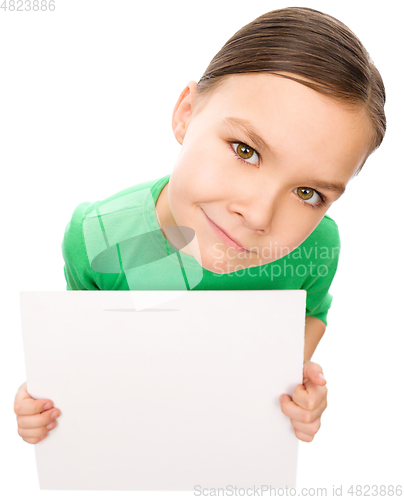 Image of Happy little girl is holding blank board