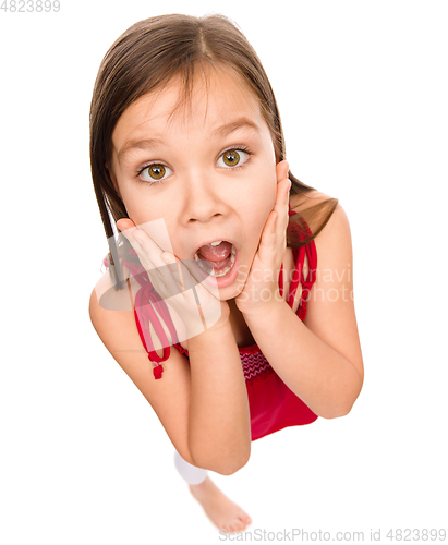 Image of Little girl is holding her face in astonishment