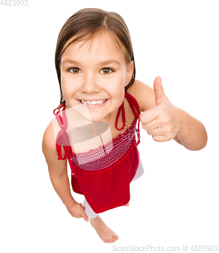 Image of Little girl is showing thumb up gesture