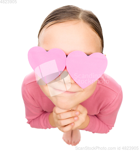 Image of Little girl with hearts over her eyes