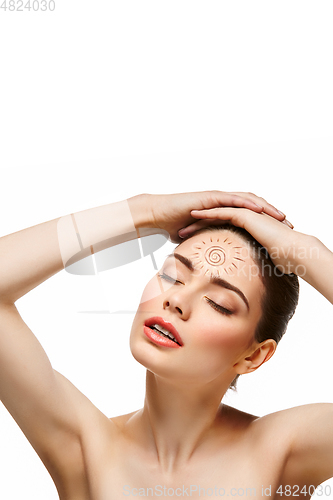 Image of girl with sun drawing on forehead isolated on white