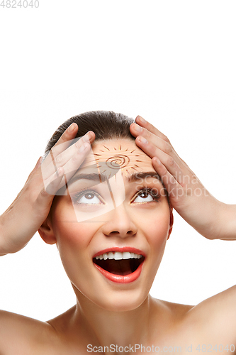 Image of girl with sun drawing on forehead isolated on white