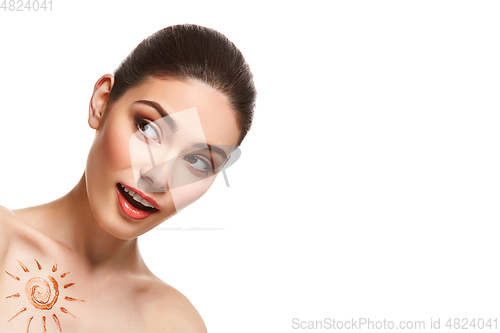 Image of girl with sun drawing on forehead isolated on white