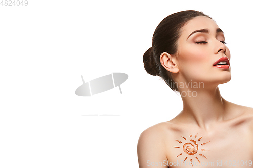 Image of girl with sun drawing on forehead isolated on white