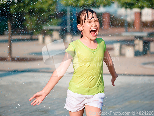 Image of Girl is running through fountains