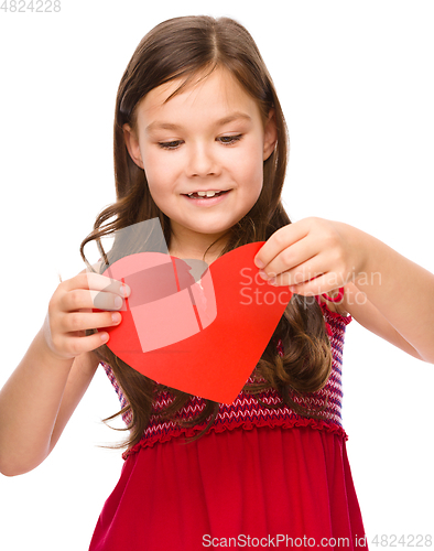 Image of Portrait of a happy little girl in red