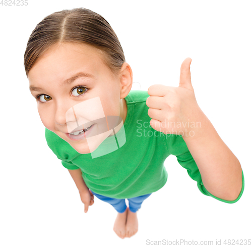 Image of Little girl is showing thumb up gesture