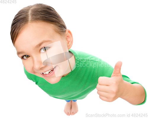 Image of Little girl is showing thumb up gesture