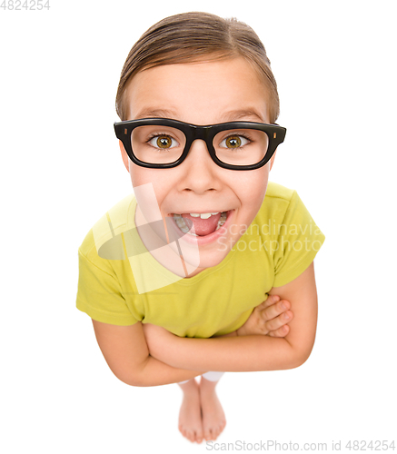 Image of Portrait of a happy little girl wearing glasses