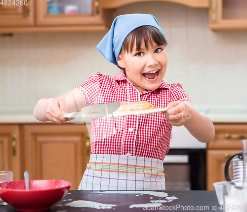 Image of Girl is cooking in kitchen