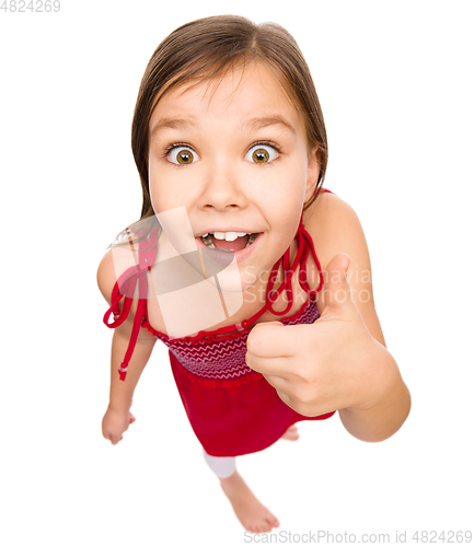 Image of Little girl is showing thumb up gesture