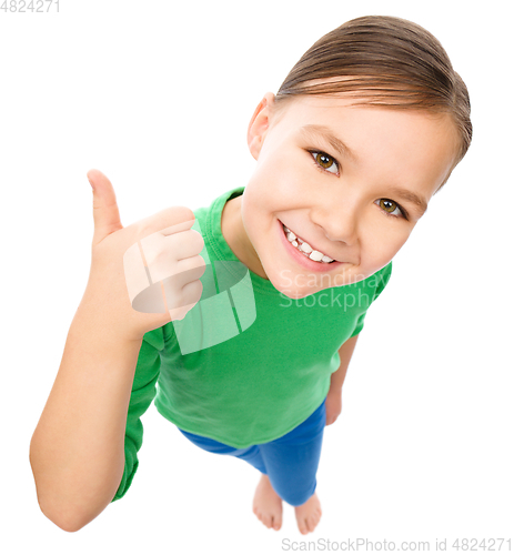 Image of Little girl is showing thumb up gesture