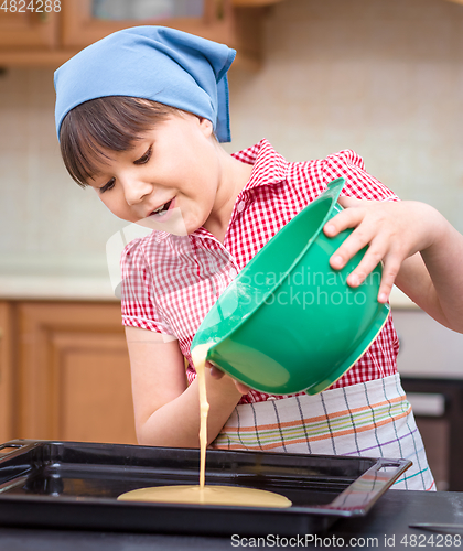 Image of Girl is cooking in kitchen