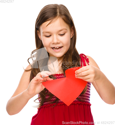 Image of Portrait of a happy little girl in red