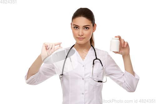 Image of woman doctor with pills isolated on white